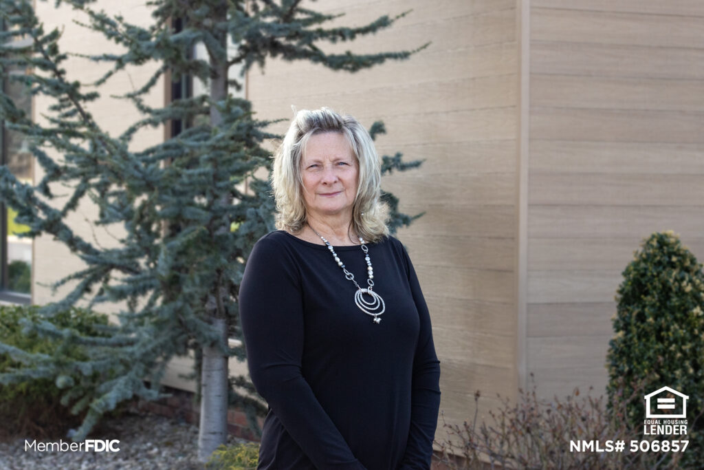 Kimmy Walker stands in front of Woodlands Bank's Loyalsock office