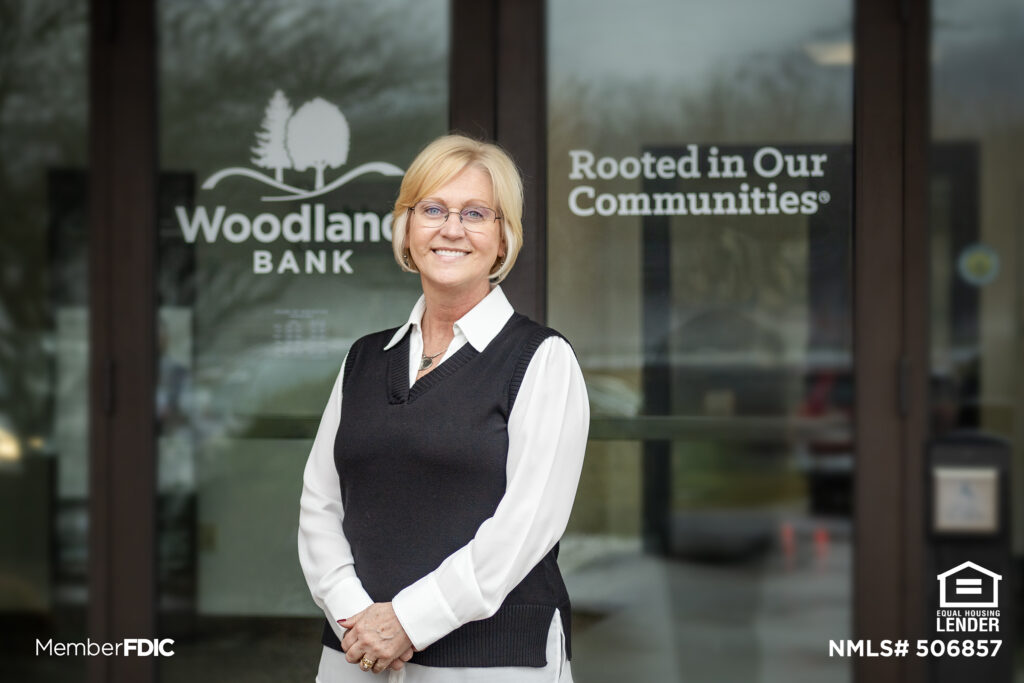 Wanda Fortin stands in front of Woodlands Bank's Loyalsock office